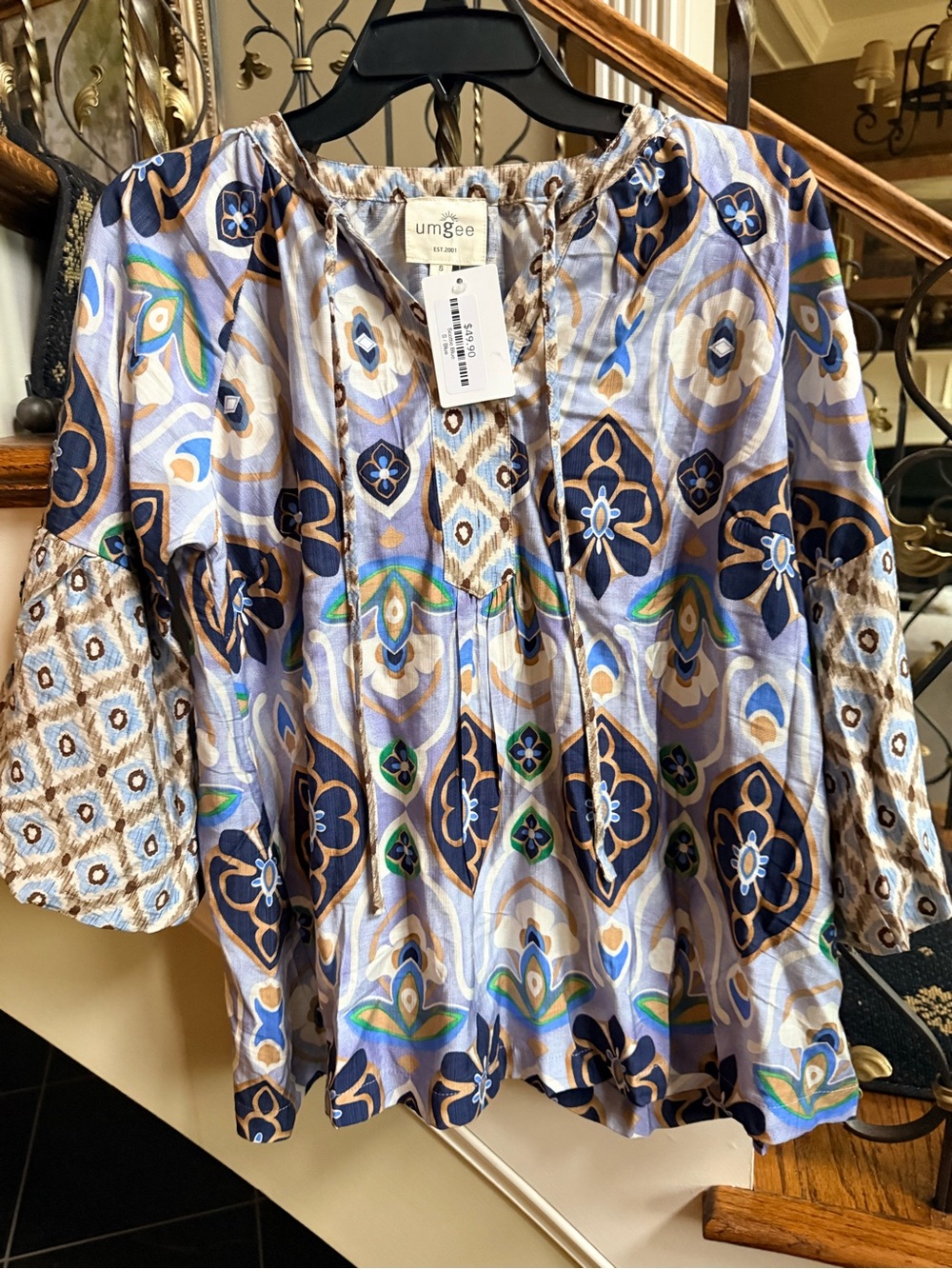 Umgee NWT Scottie Blue Top. Puff sleeves. Beautiful colors. Tie neck . Size S